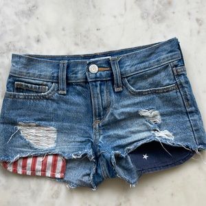 Gently used flag jean shorts